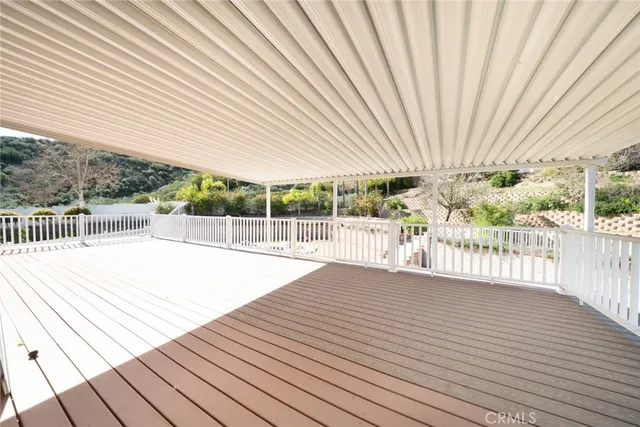 a view of a house with swimming pool and sitting area
