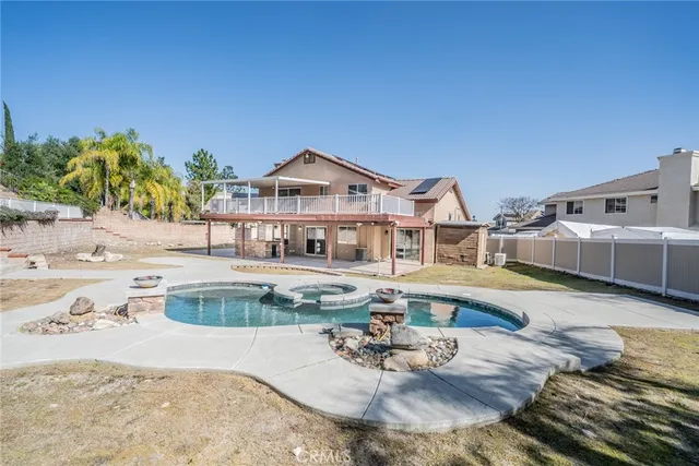 a view of a swimming pool with a patio