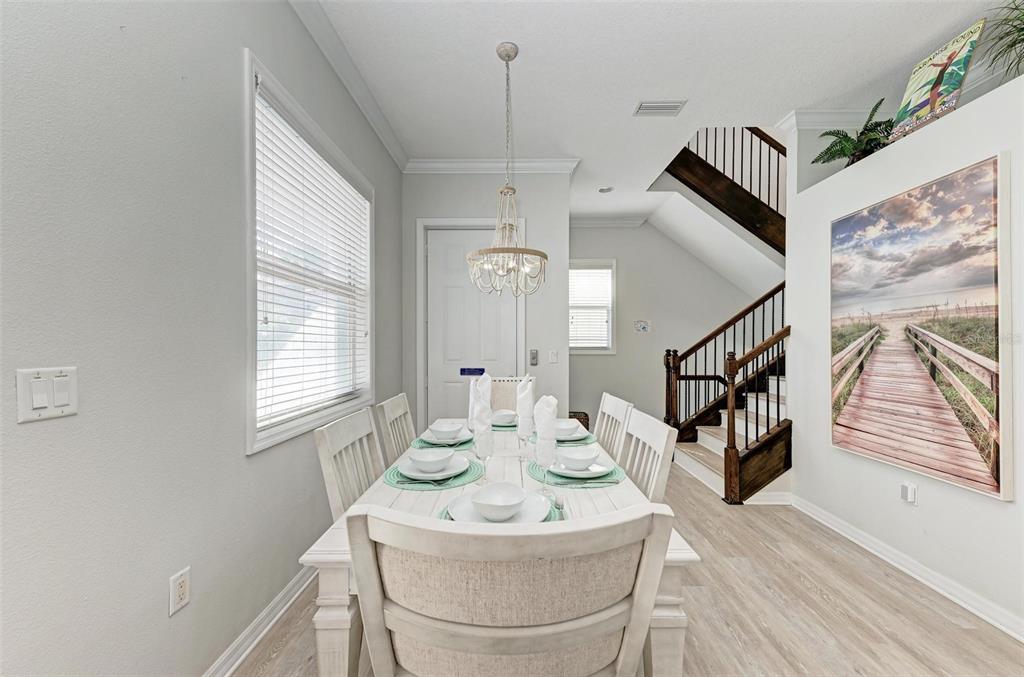 201 57th Street Holmes Beach, FL 34217 - Photo 13 of 48 a view of a dining room with furniture and a window