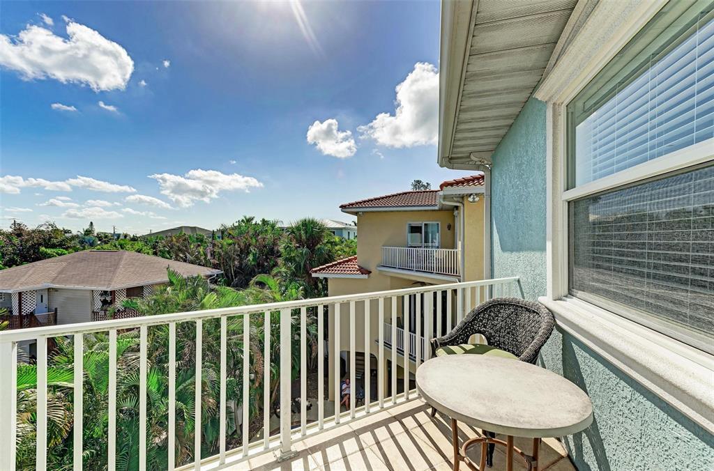 201 57th Street Holmes Beach, FL 34217 - Photo 25 of 48 a view of a balcony with chairs