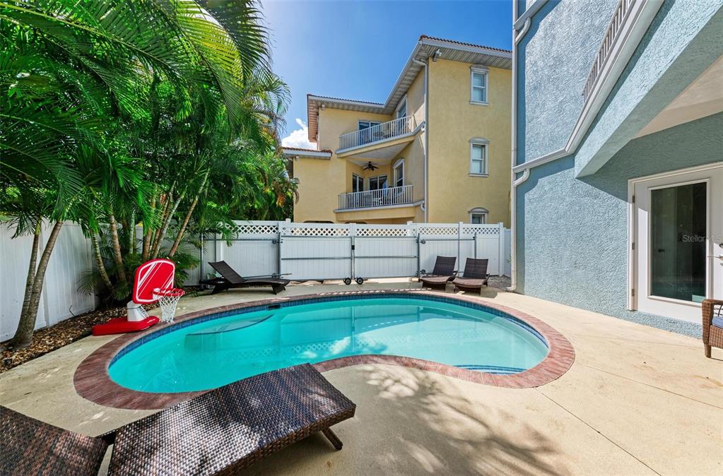 201 57th Street Holmes Beach, FL 34217 - Photo 38 of 48 a view of a swimming pool with sitting area
