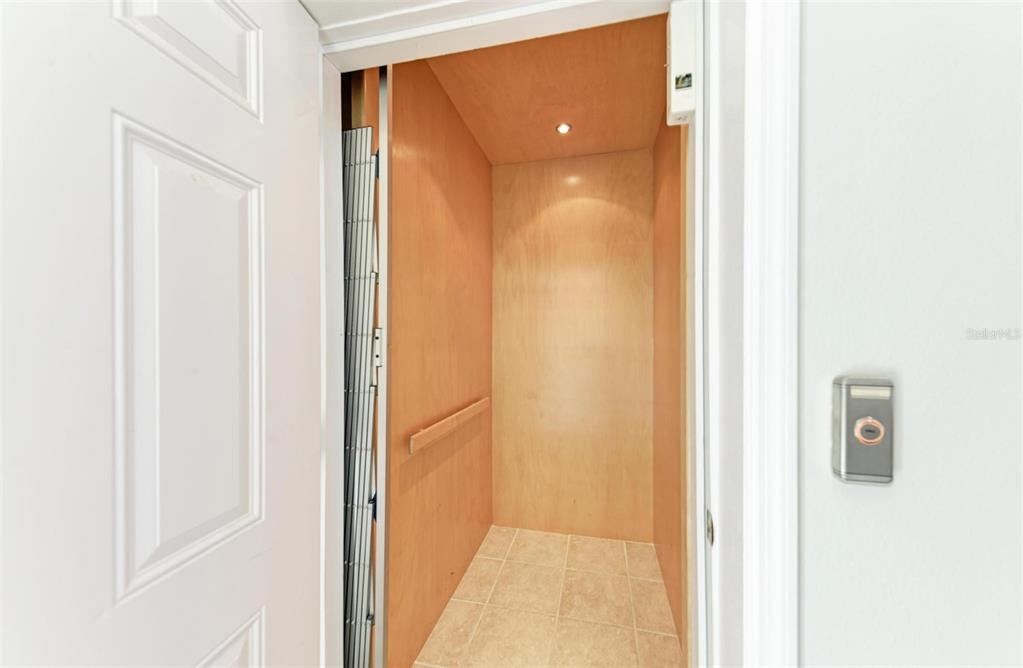 201 57th Street Holmes Beach, FL 34217 - Photo 39 of 48 a view of a bathroom from a hallway