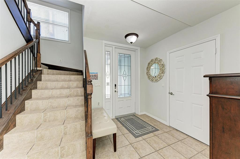 201 57th Street Holmes Beach, FL 34217 - Photo 40 of 48 a view of an entryway with wooden floor and a rug
