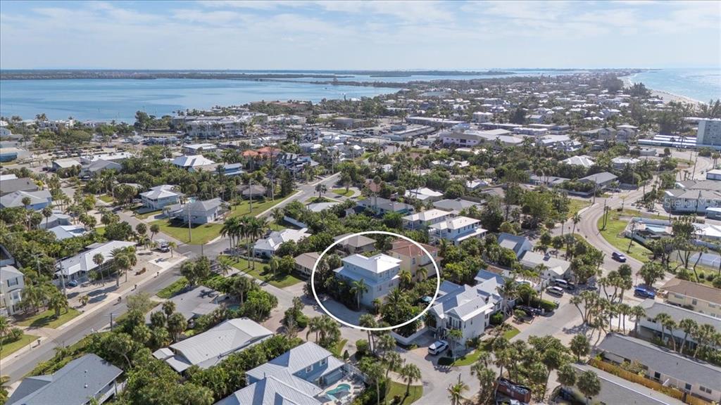 201 57th Street Holmes Beach, FL 34217 - Photo 43 of 48 an aerial view of a city with lots of residential buildings