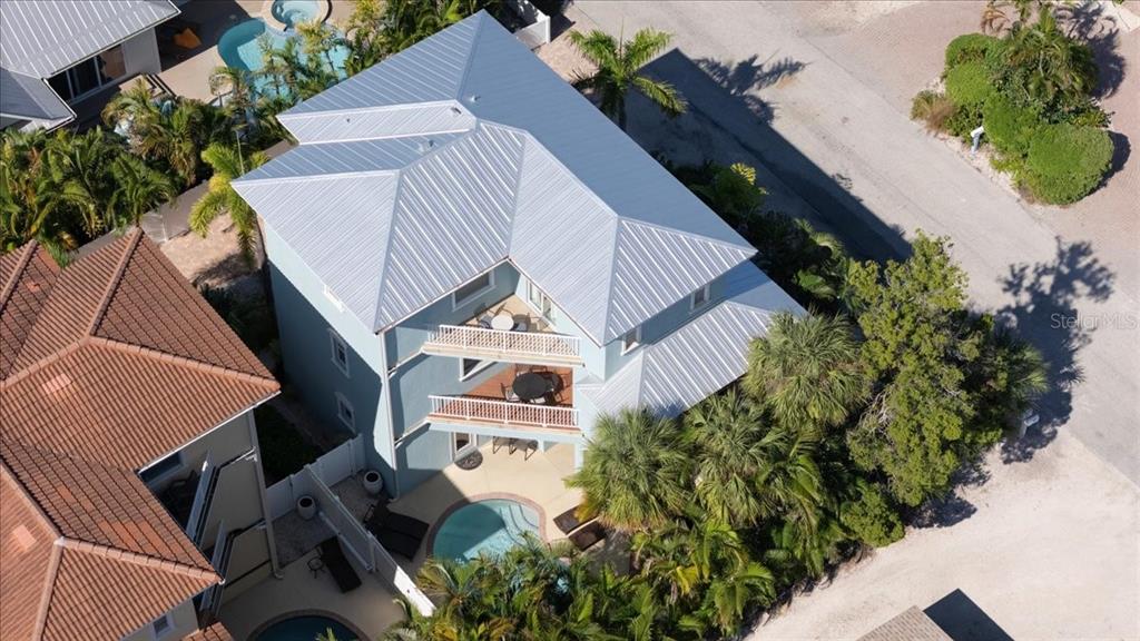 201 57th Street Holmes Beach, FL 34217 - Photo 48 of 48 an aerial view of a house with a yard and garden
