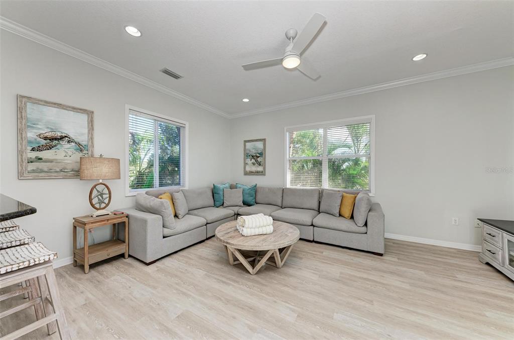 201 57th Street Holmes Beach, FL 34217 - Photo 9 of 48 a living room with furniture and a large window
