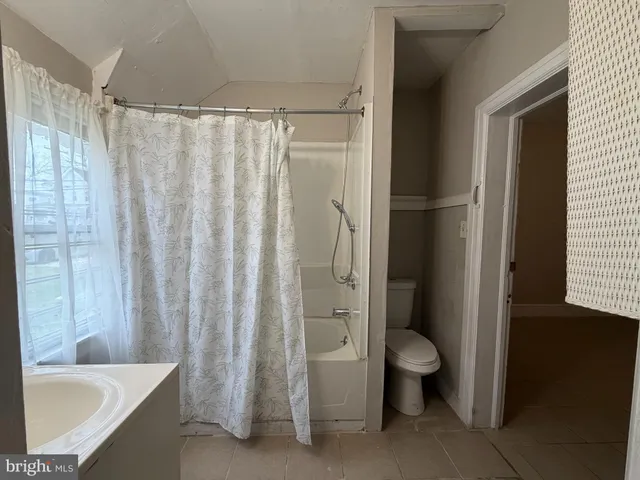 a bathroom with a toilet and a sink