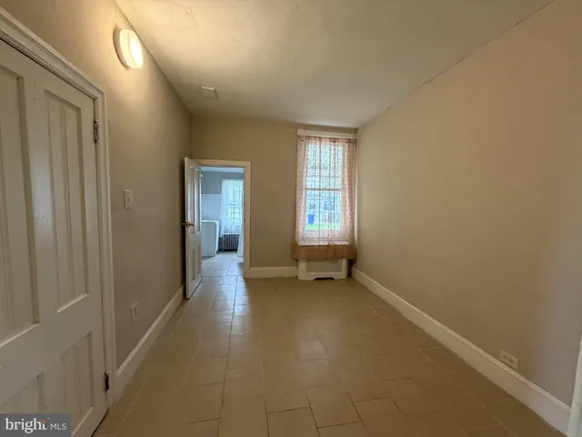 a view of empty room with windows