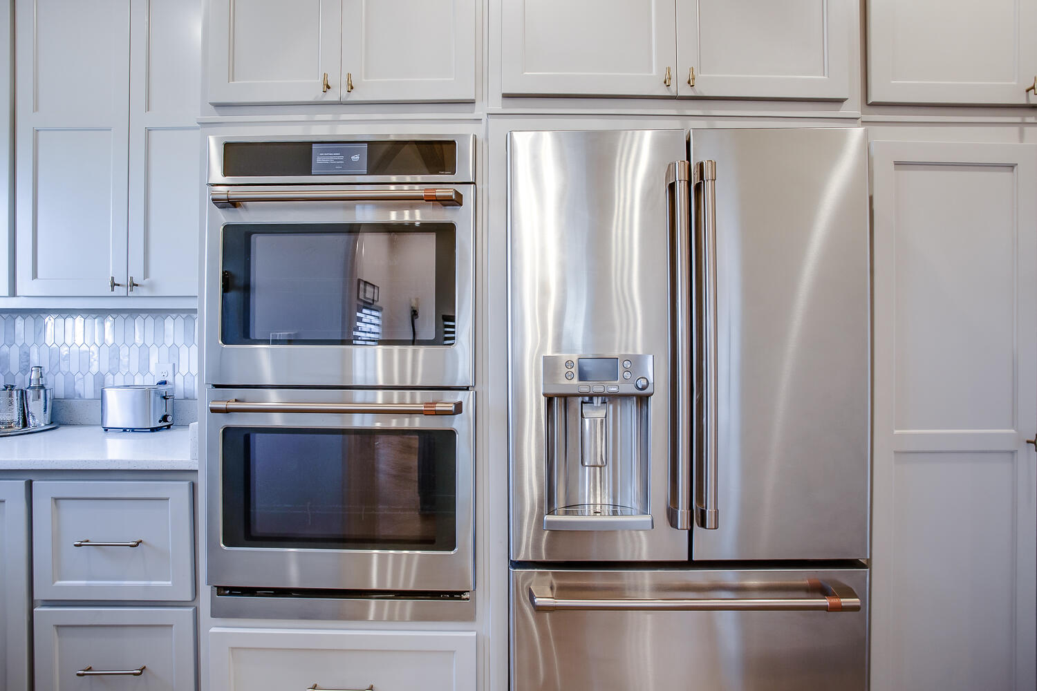 7601 53rd Street Lubbock, TX 79407 - Photo 11 of 33 a kitchen with cabinets and stainless steel appliances