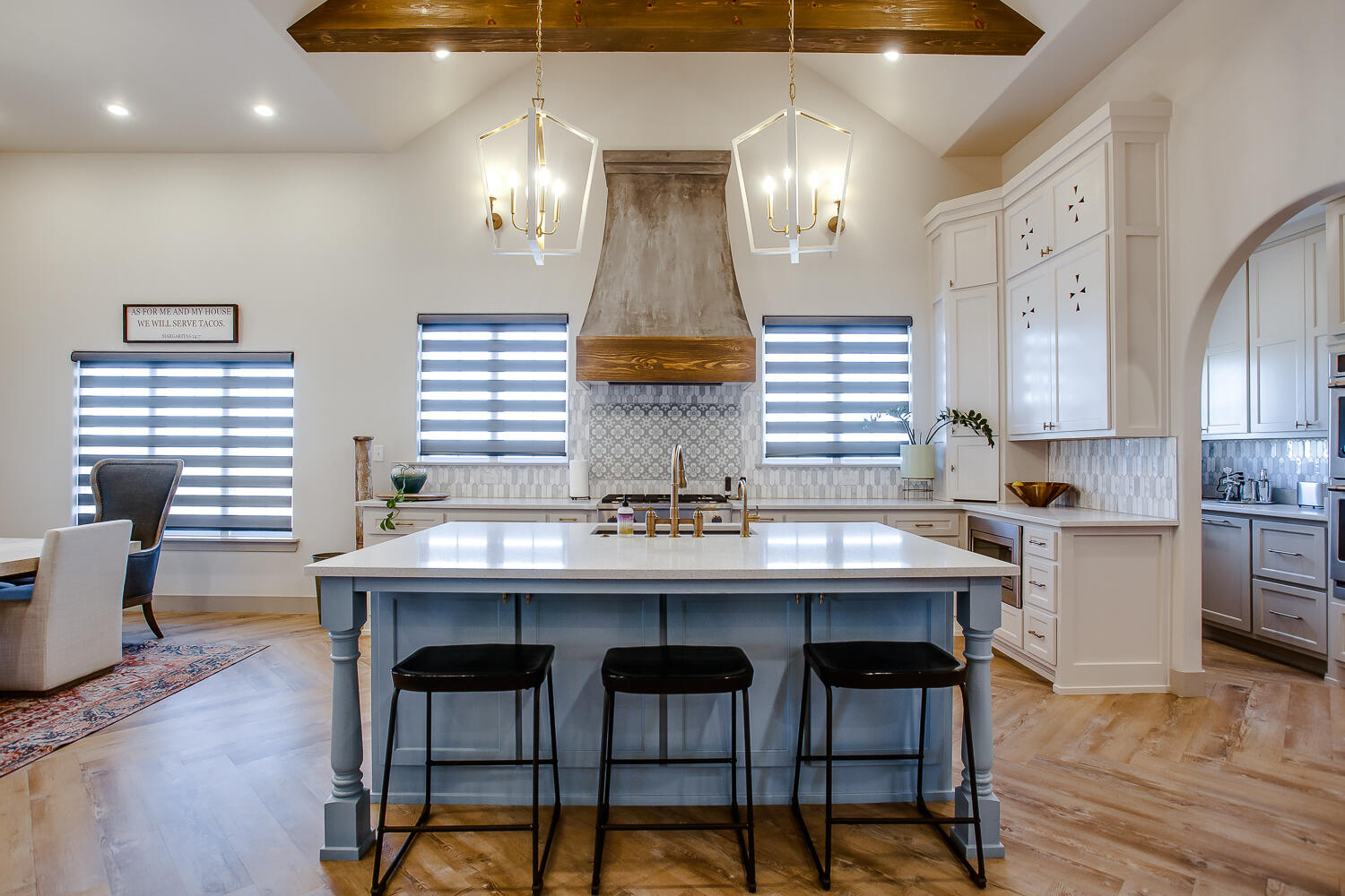 7601 53rd Street Lubbock, TX 79407 - Photo 2 of 33 a kitchen with a dining table chairs cabinets and stainless steel appliances