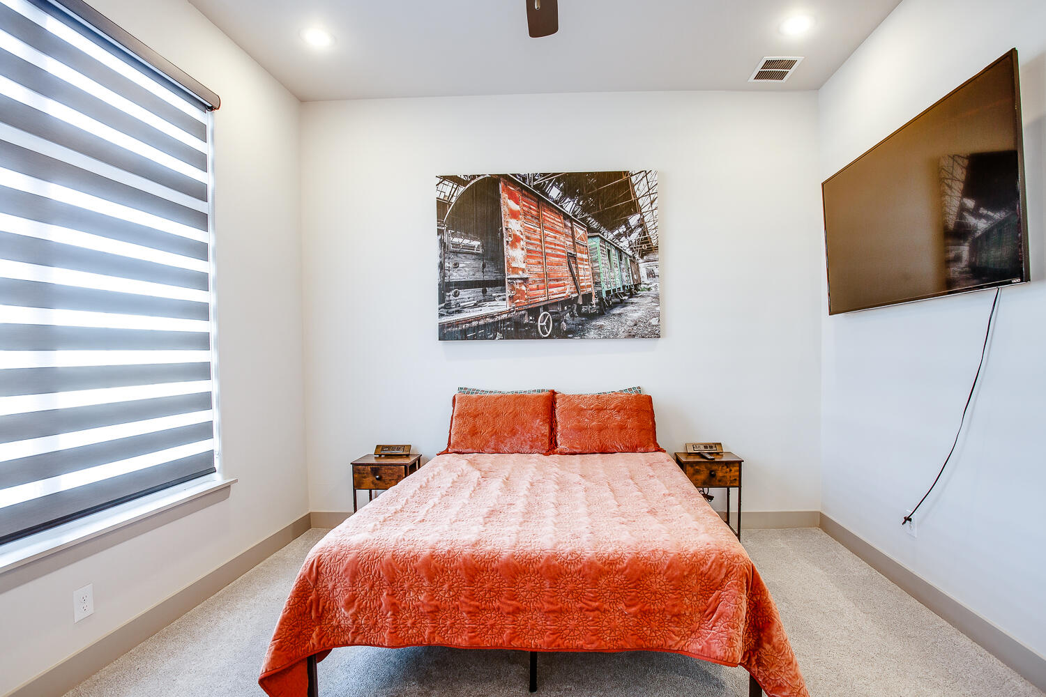7601 53rd Street Lubbock, TX 79407 - Photo 24 of 33 a bed sitting in a bedroom next to a window