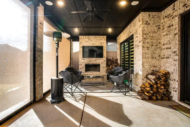 a view of a livingroom with furniture and a fireplace
