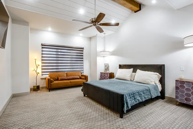 a bedroom with a bed and furniture