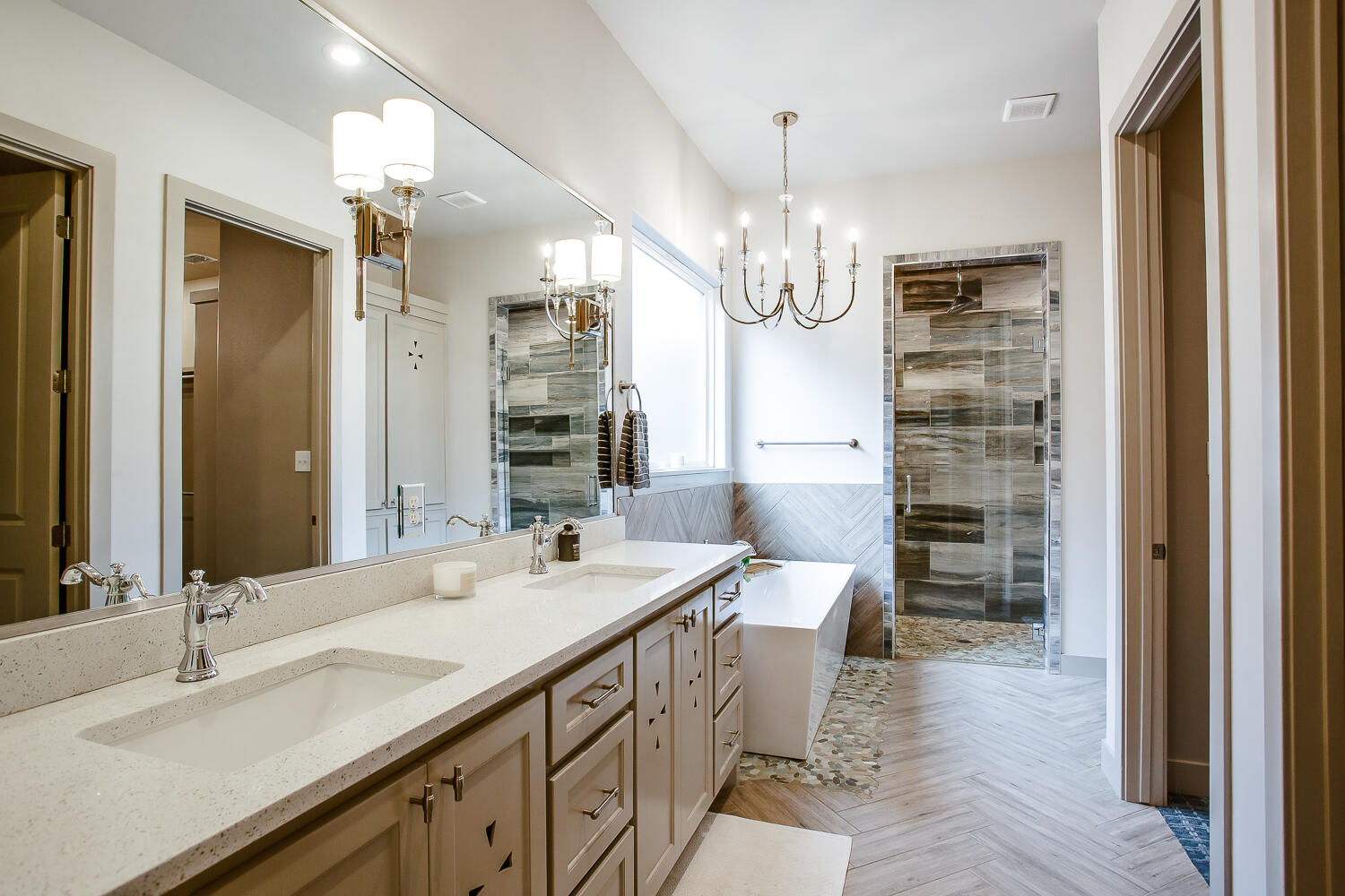 7601 53rd Street Lubbock, TX 79407 - Photo 5 of 33 a bathroom with a double vanity sink a mirror and a shower