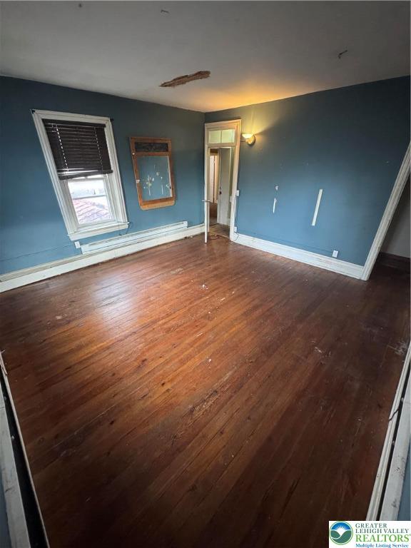 4856 Huckleberry Road Orefield, PA 18069 - Photo 20 of 23 an empty room with wooden floor and windows