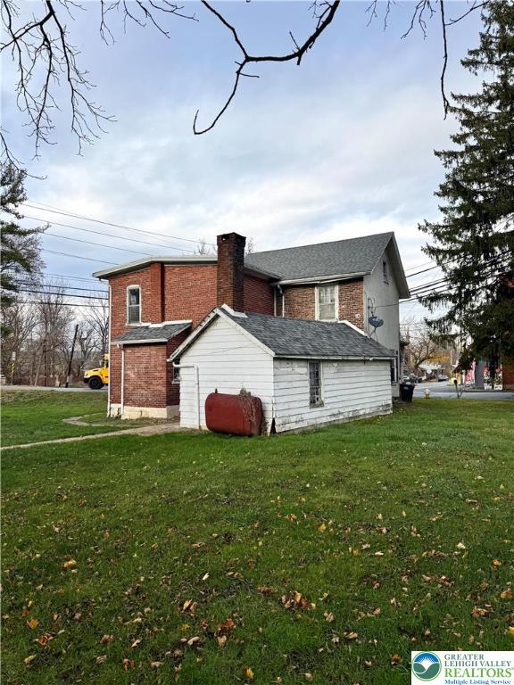4856 Huckleberry Road Orefield, PA 18069 - Photo 2 of 23 a view of a house with a big yard and large windows