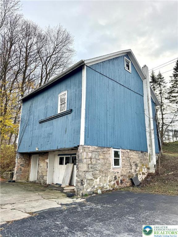 4856 Huckleberry Road Orefield, PA 18069 - Photo 5 of 23 a front view of a house with a yard
