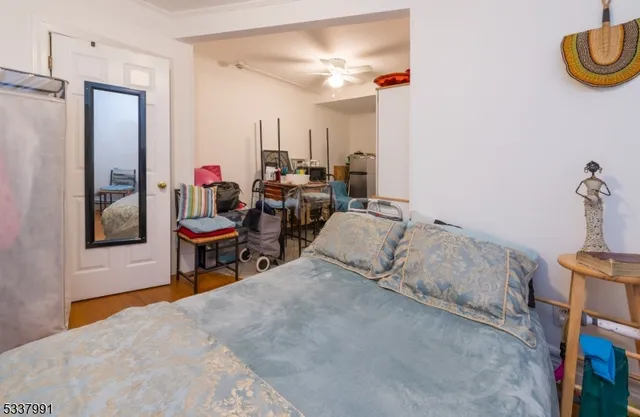 a bedroom with furniture and a window