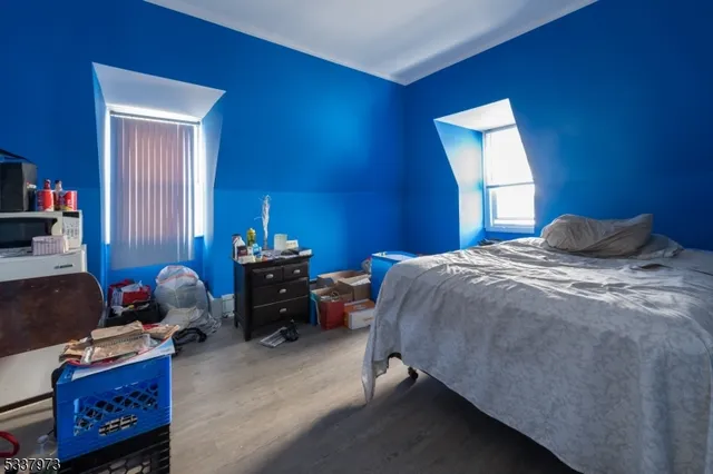 a bed room with a bed and a window