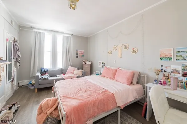 a bedroom with furniture and a bed