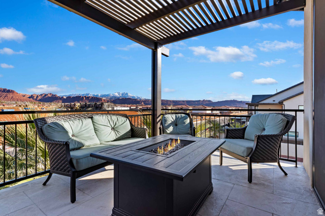 2600 Ocotillo Way, Unit 31 Santa Clara, UT 84765 - Photo 45 of 73 Outdoor patio featuring a black metal pergola, tiled flooring, and a built-in fire table