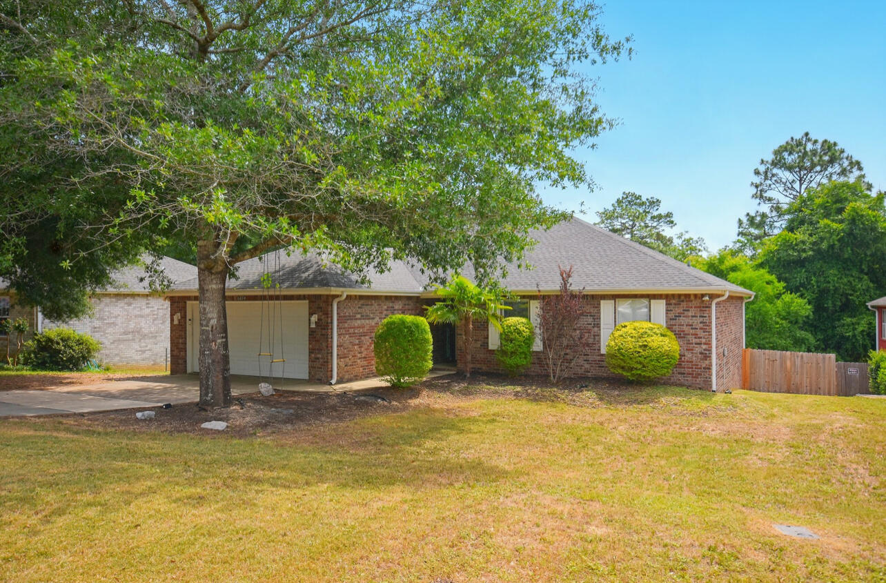 6474 Moonlight Lane Crestview, FL 32539 - Photo 1 of 39 a view of a house with basketball court