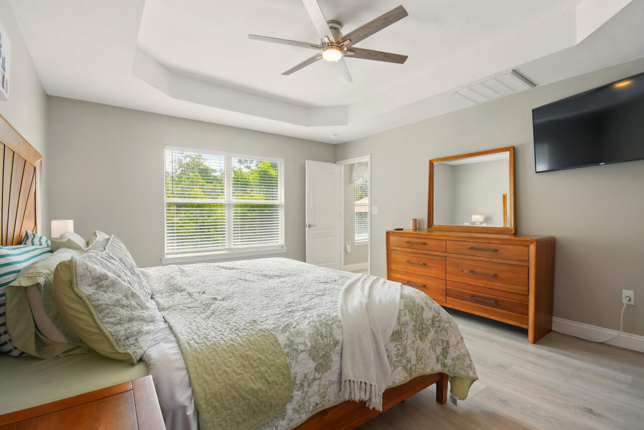 6474 Moonlight Lane Crestview, FL 32539 - Photo 11 of 39 a bedroom with a bed and a flat screen tv