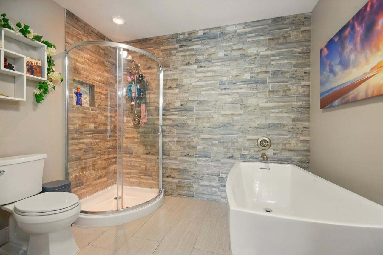6474 Moonlight Lane Crestview, FL 32539 - Photo 13 of 39 a bathroom with a toilet and a shower