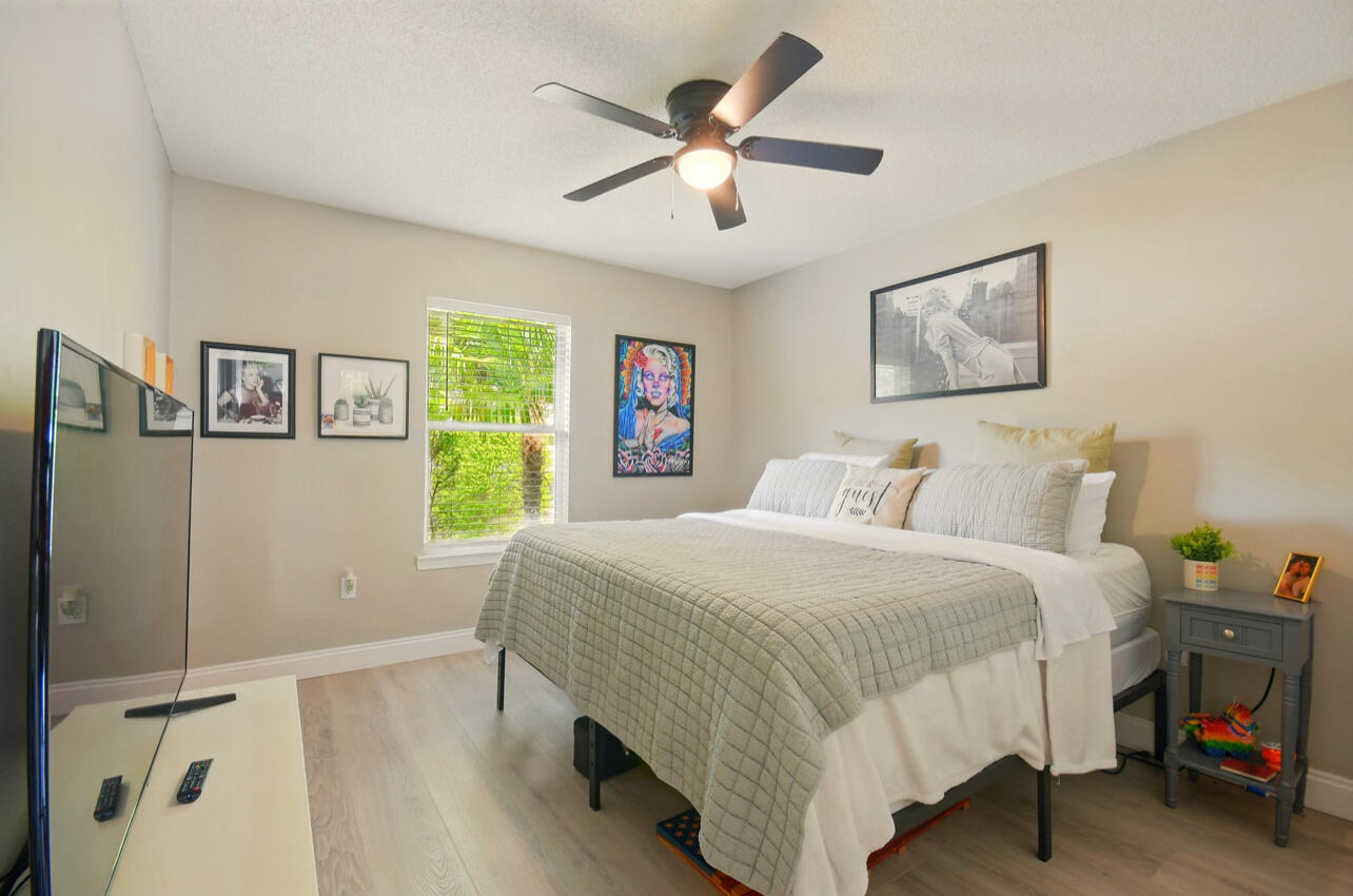 6474 Moonlight Lane Crestview, FL 32539 - Photo 16 of 39 a bedroom with a bed and a table in it
