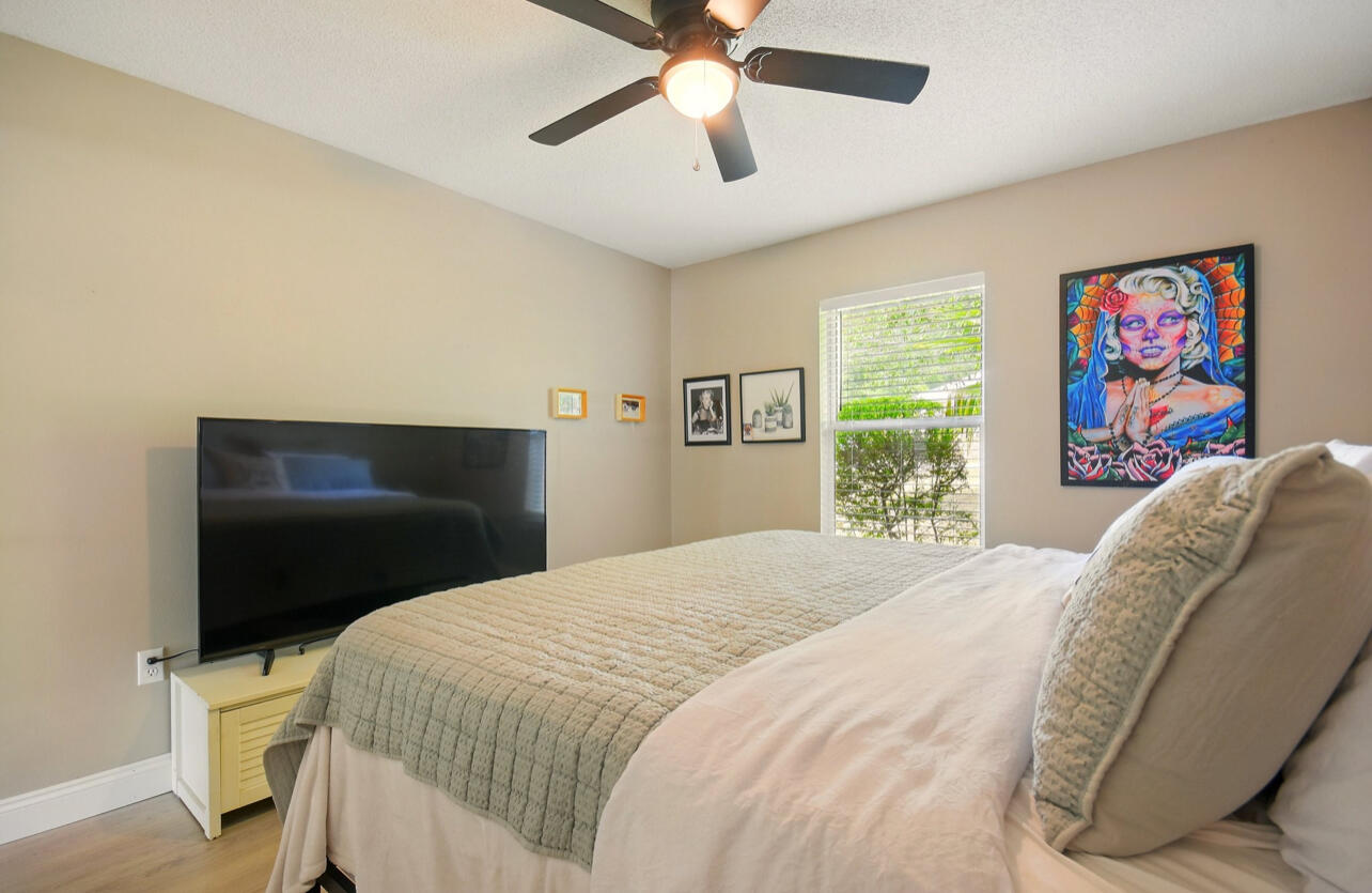 6474 Moonlight Lane Crestview, FL 32539 - Photo 18 of 39 a bedroom with a bed and a painting on the wall