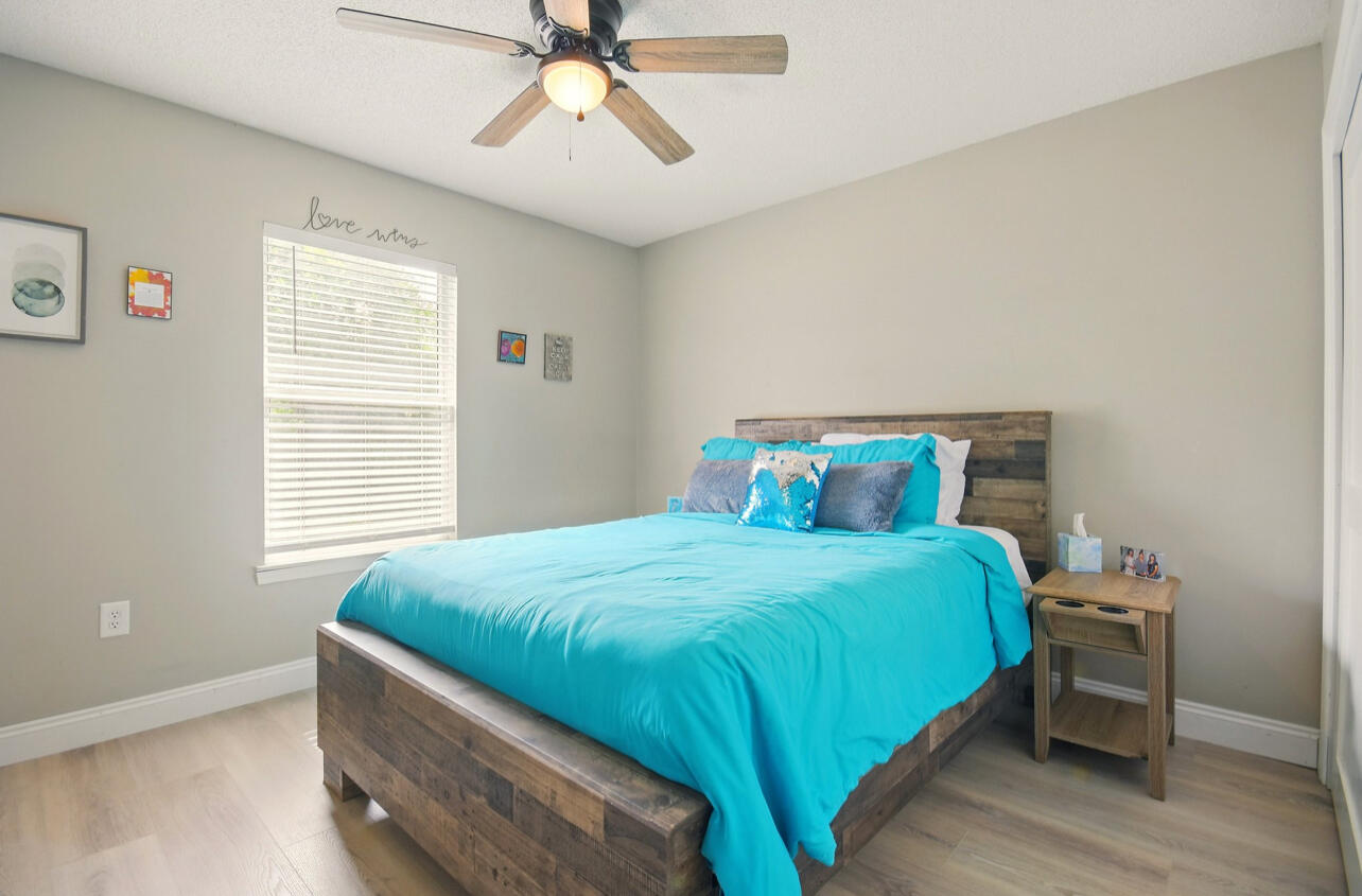 6474 Moonlight Lane Crestview, FL 32539 - Photo 21 of 39 a bedroom with a bed and window