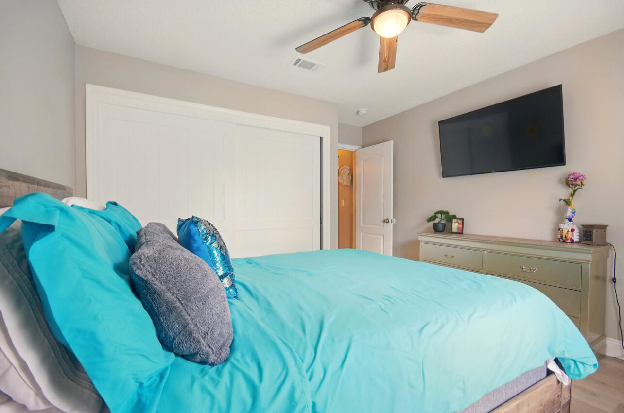 6474 Moonlight Lane Crestview, FL 32539 - Photo 22 of 39 a bedroom with a bed and a flat screen tv