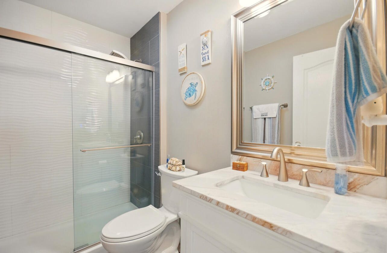 6474 Moonlight Lane Crestview, FL 32539 - Photo 25 of 39 a bathroom with a granite countertop toilet sink and shower