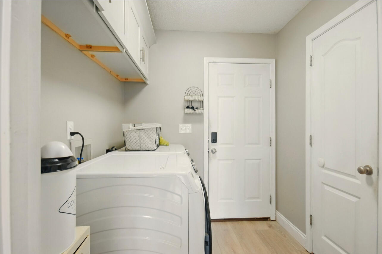 6474 Moonlight Lane Crestview, FL 32539 - Photo 34 of 39 a bedroom with a bed and wooden floor