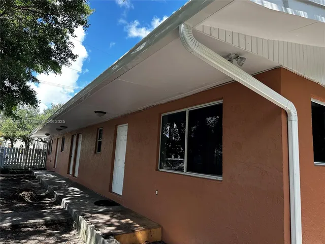 a view of a house with a large window