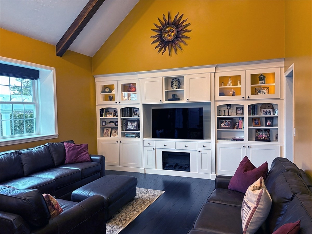 14 Cavite Street Devens, MA 01434 - Photo 13 of 40 a living room with furniture a fireplace and a flat screen tv