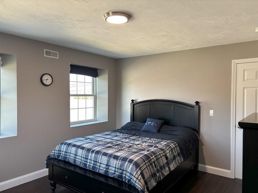 14 Cavite Street Devens, MA 01434 - Photo 19 of 40 a bedroom with a bed and window