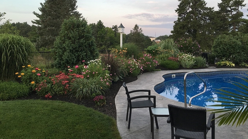 14 Cavite Street Devens, MA 01434 - Photo 4 of 40 a view of a chairs and table in the garden