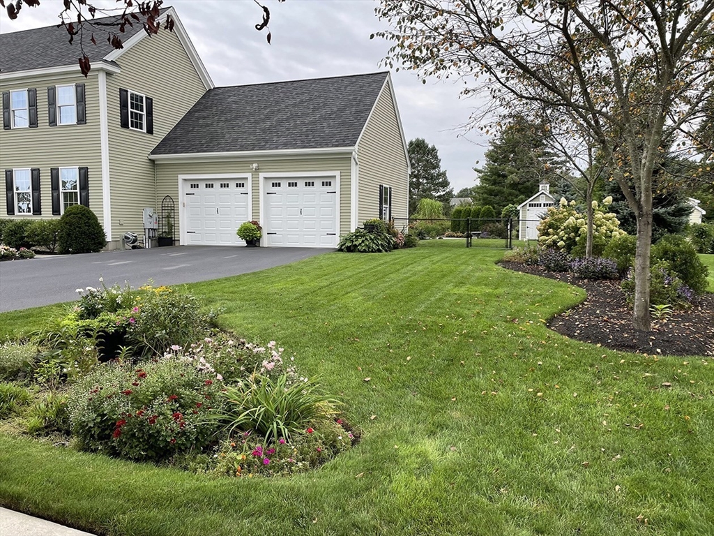 14 Cavite Street Devens, MA 01434 - Photo 8 of 40 a front view of a house with a garden
