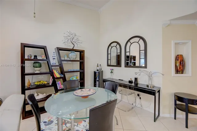 a living room with dining table