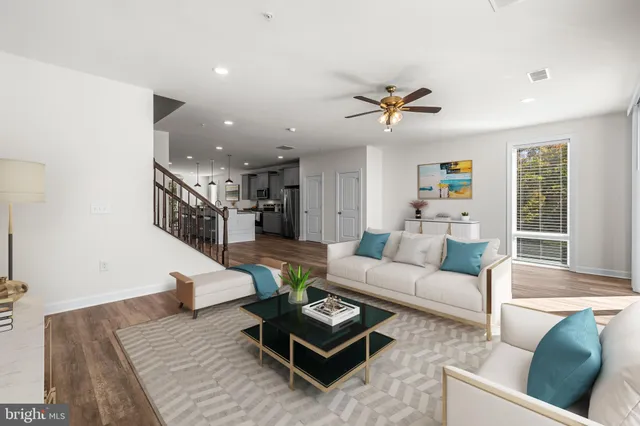 a living room with furniture rug and window