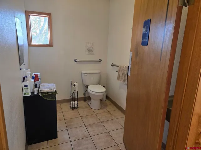 a picture of a bathroom with a shower