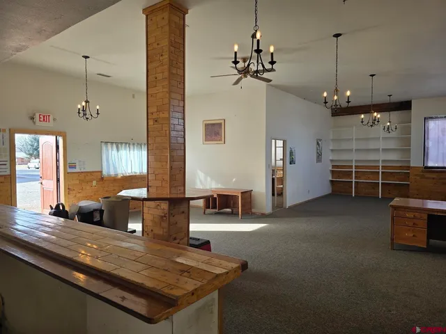 a view of a livingroom with furniture window and wooden floor