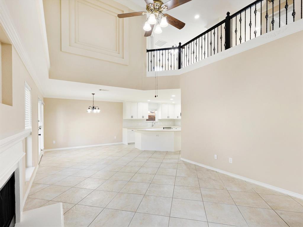 720 Pheasant Road Saginaw, TX 76131 - Photo 14 of 40 a view of a kitchen with a sink and dishwasher with white walls