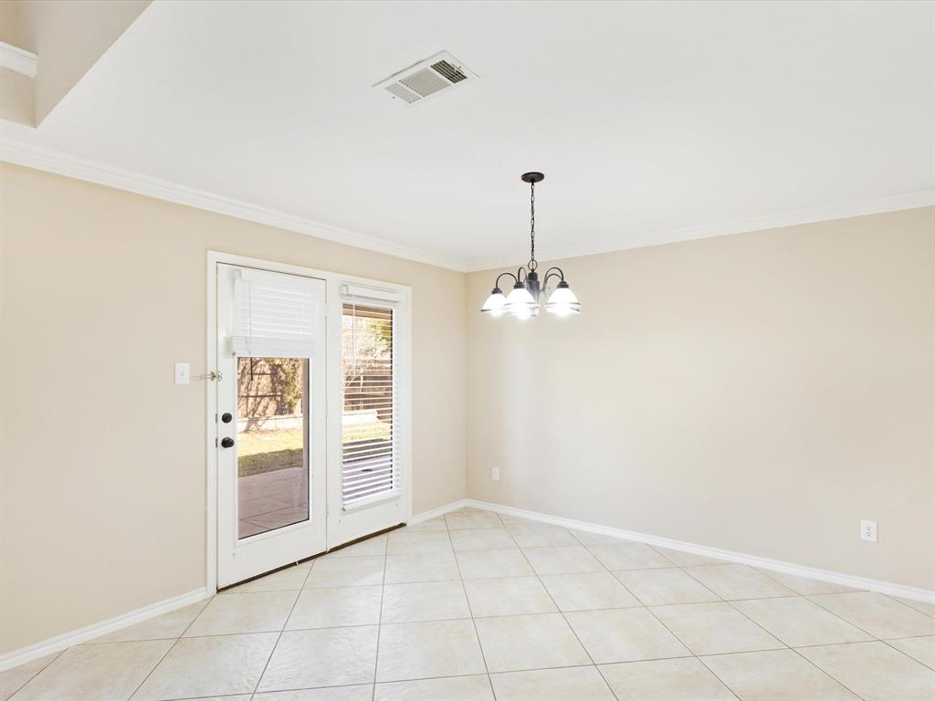 720 Pheasant Road Saginaw, TX 76131 - Photo 15 of 40 a view of a kitchen with white cabinets