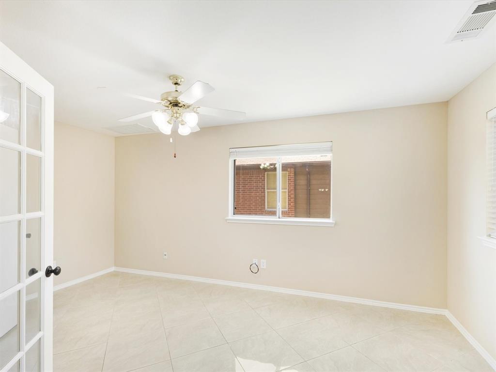 720 Pheasant Road Saginaw, TX 76131 - Photo 17 of 40 a view of an empty room with a window
