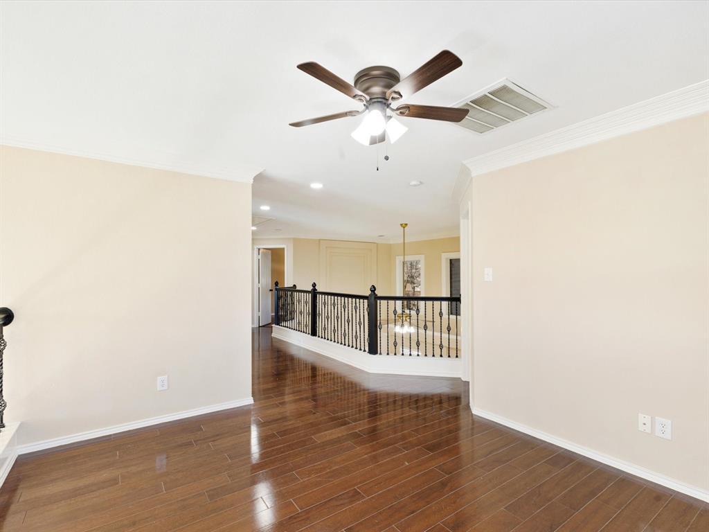 720 Pheasant Road Saginaw, TX 76131 - Photo 22 of 40 a view of a room with wooden floor