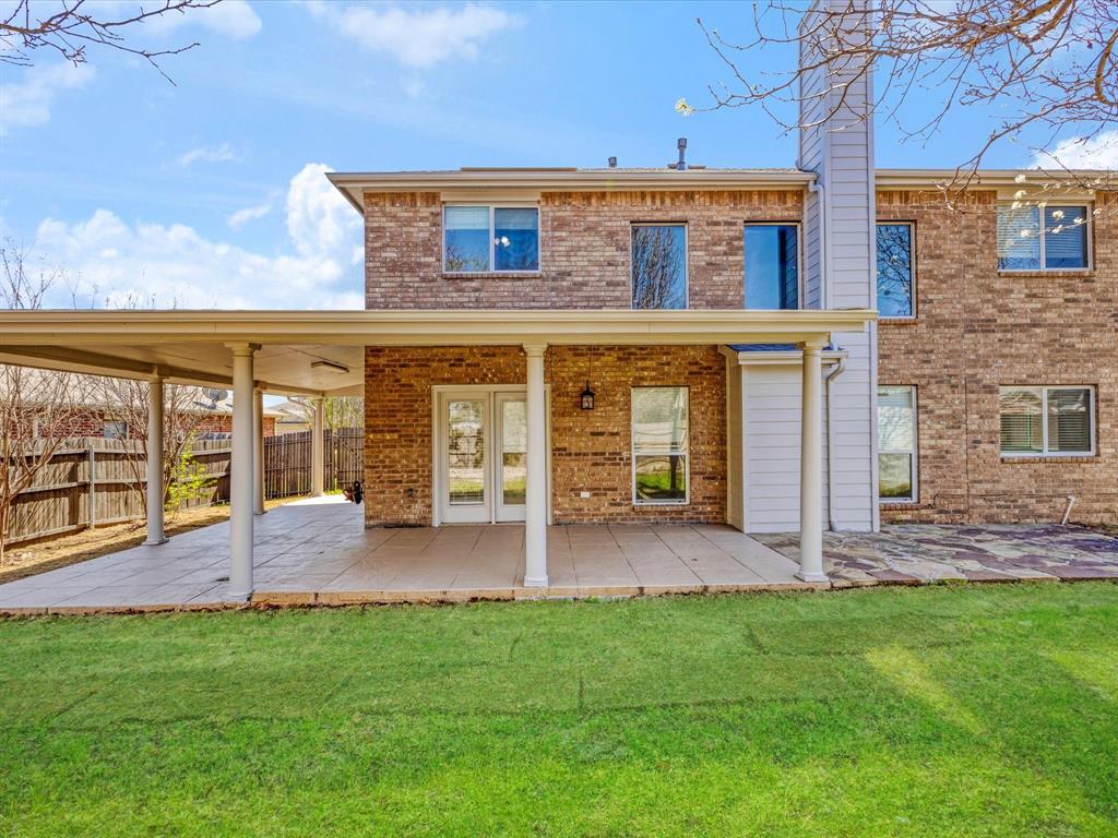 720 Pheasant Road Saginaw, TX 76131 - Photo 31 of 40 front view of a brick house with a yard