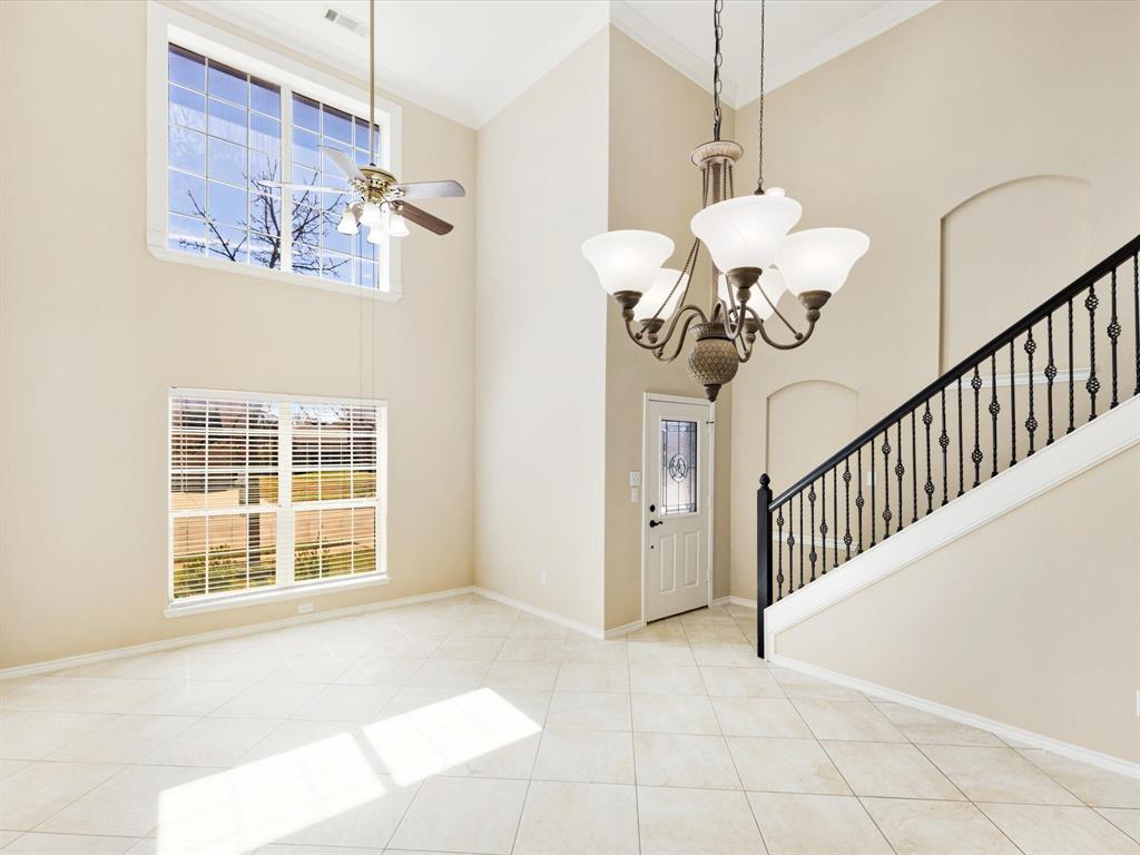 720 Pheasant Road Saginaw, TX 76131 - Photo 5 of 40 a view of a room with a window and chandelier