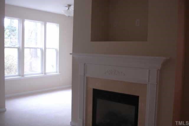 2332 Putters Way Raleigh, NC 27614 - Photo 4 of 11 Fireplace with gas logs and a TV niche